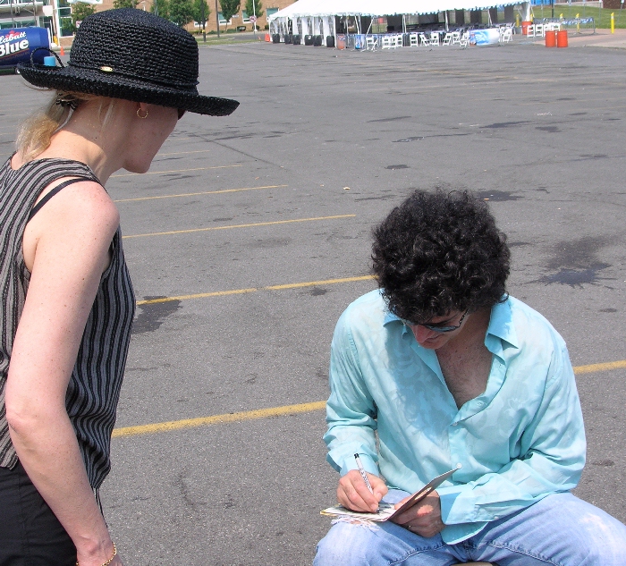 Gino with a fan after soundcheck for the Syracuse Jazz Festival on June 25th, 2005
